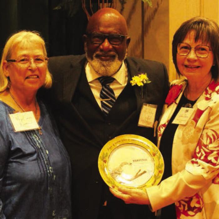 The late Maezell Thomas Stafford Townsend was honored Suday in the area of “Heritage.” The Rev. Andrew Stafford accepted the award on her behalf. She was introduced by Schulenburg mayor Connie Koopmann, left. Right is LWV program coordinator Helen Niesner.