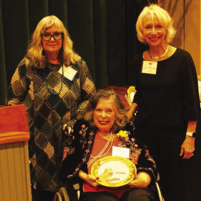 Karey Patterson Bresenhan, center, was honored Sunday in the area of “Vision.” She was introduced by Laura Logan, left. Right is Janis Richardson President, League of Women Voters of South Central Texas.