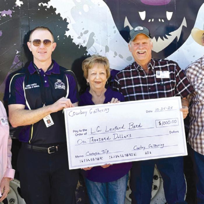 The Best Little Cowboy Gathering in Texas recently made a donation of $1,000 towards the LHS Mighty Leopard Band for their upcoming trip to Carnegie Hall. Pictured are Gloria Heinrich, Chris Cooper, La Grange High School Band Director, Barbara Kalina, Jon Quinn, and Bobby Gronewald.