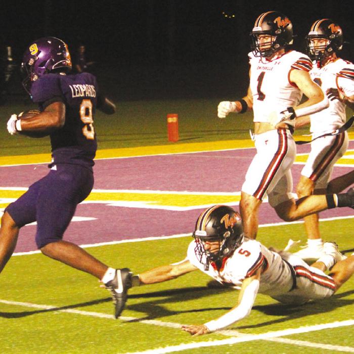 Above: La Grange’s Dillan Johnson trots into the endzone for one of his three first half rushing touchdowns Friday.