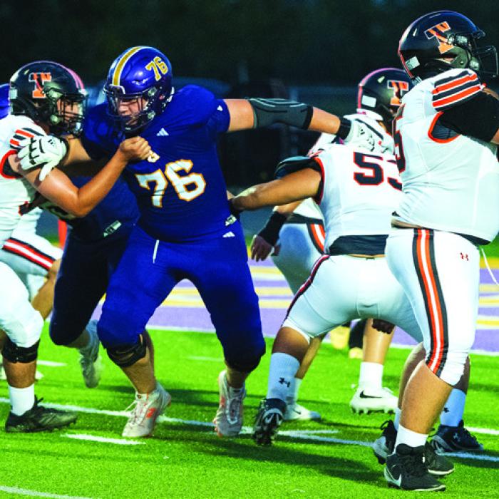 La Grange’s Whitaker Samples (No. 76) fights his way through the line. Photo by Jeremy Miller Photo by Jeremy Miller