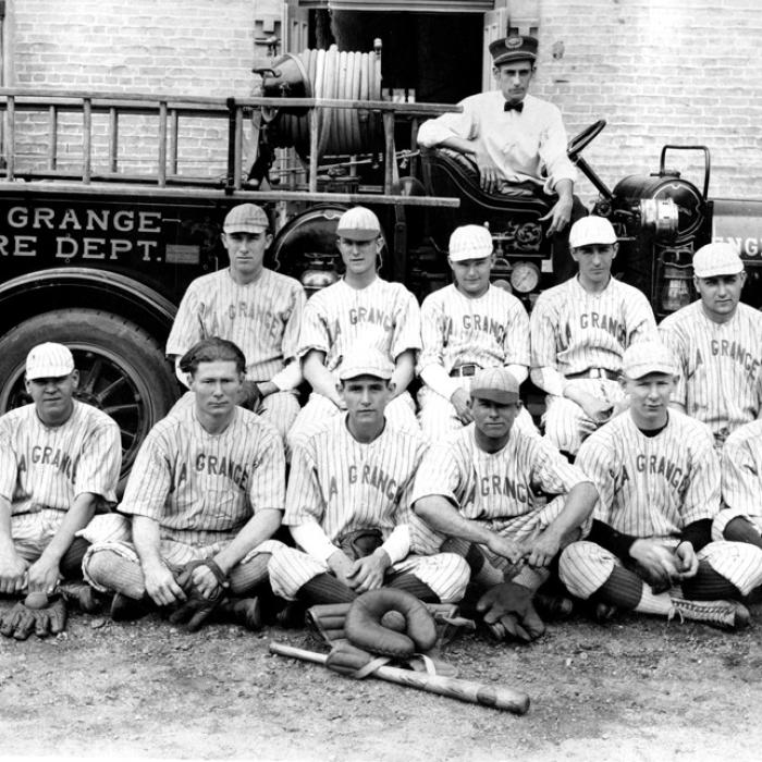 La Grange baseball team posed in front of a fire engine, probably from the 1920s. (Courtesy of the Fayette Heritage Museum and Archives)