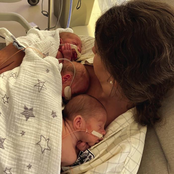 The first time Diane held all three babies.