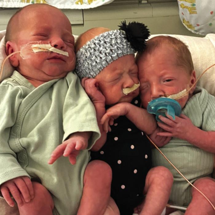 Owen, Evelyn and Daniel as they celebrated their one-month birthday in the hospital.