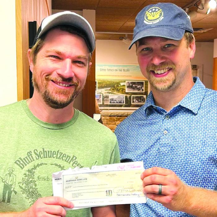 Recently the Bluff Schuetzen Fest raised funds in support of Friends of Kreische Brewery &amp; Monument Hill Historic Sites. Rutersville Hermann Sons Life contributed $500 towards the event. This contribution was duplicated with a $500 matching funds check from the Hermann Sons Life home office in San Antonio. Hermann Sons Life agent Kyle Hartmann is shown presenting the check to Gavin Miculka, Assistant Site Manager for Monument Hill State Park.