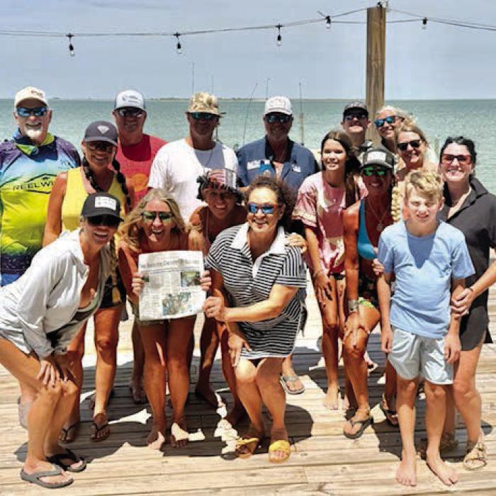 The Fayette County Record was on hand last weekend on the Matagorda Peninsula just off the coast of Port O’Connor, for the birthday celebration of former La Grange resident, Deb Fajkus Powell. Here she is holding the Record with a few of her family and friends that attended her birthday celebration.