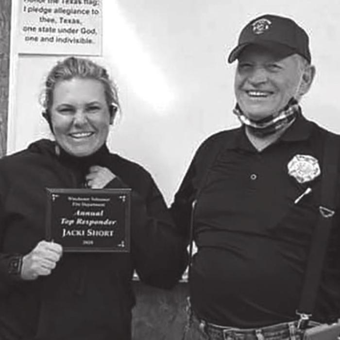 Jacki Short, left, receiving her “Responder of the Years” award from the Winchester Area VFD.