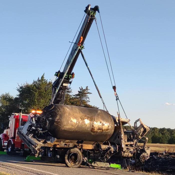 A wrecker lifts the Fayetteville Propane truck that crashed and burned near Cat Spring Monday. Photo courtesy of the Cat Spring Volunteer Fire Department