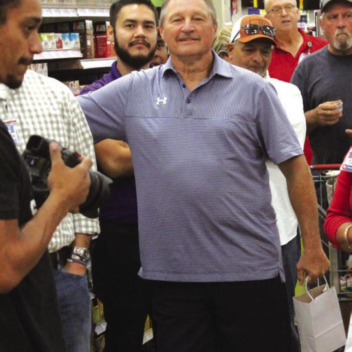 Former La Grange HEB store directors Robert Svrcek, left, and Paul Mikula, right, were recognized during a ceremony.