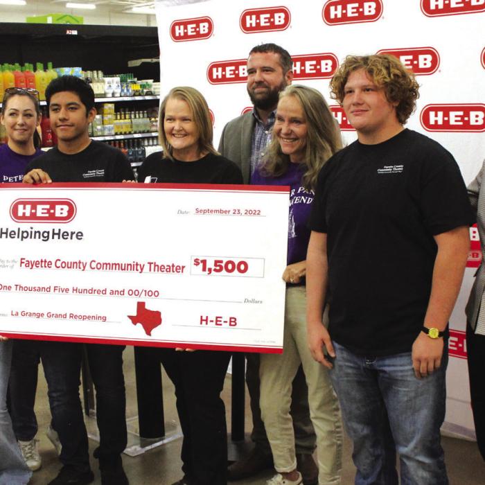 As part of the grand reopening festivities, H-E-B gave Fayette County Community Theater $1,500.