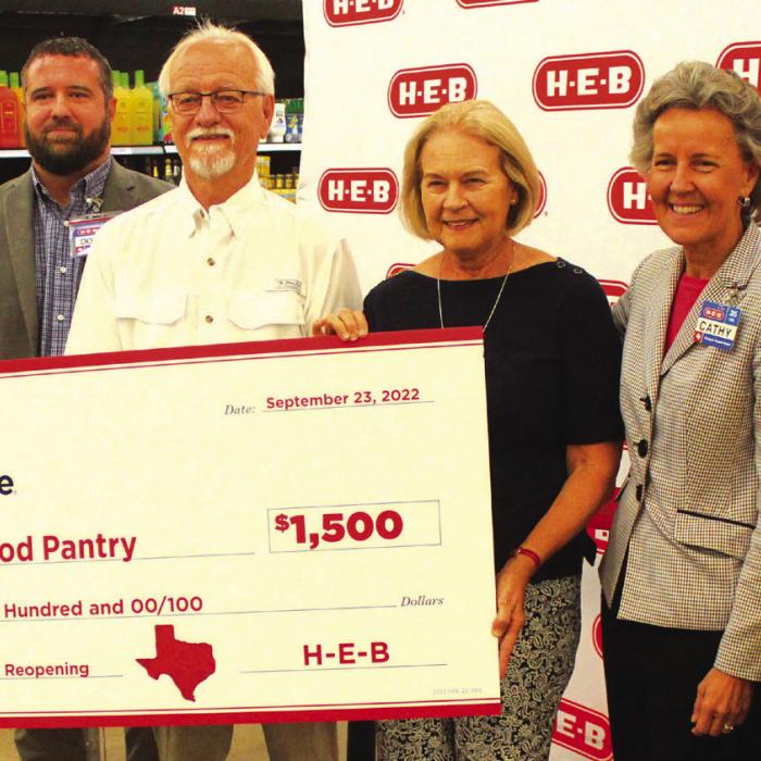 As part of the grand reopening festivities, H-E-B gave AMEN Food Pantry $1,500.