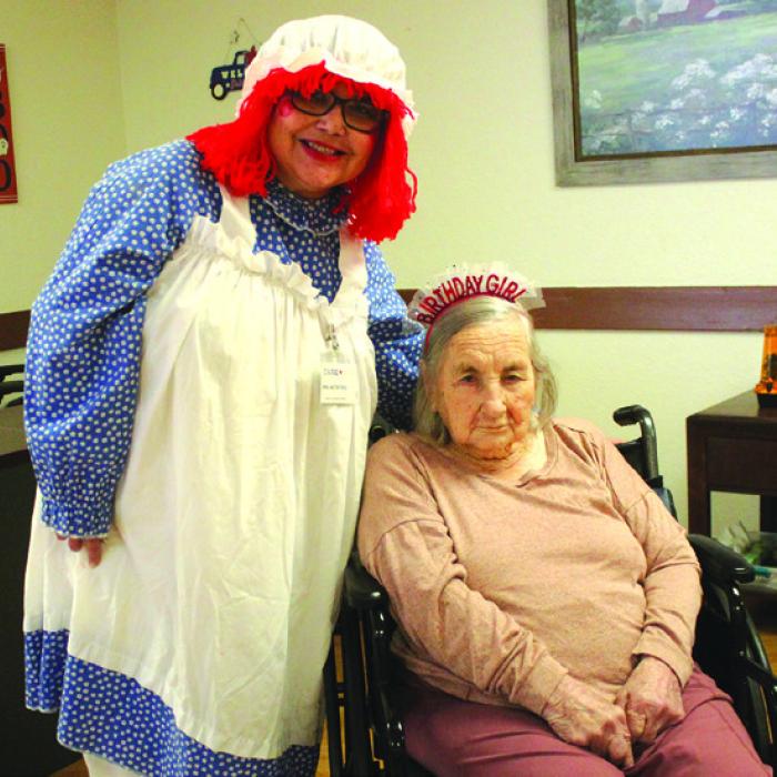 Flora Jahnz, seated, celebrated her 102nd birthday on Halloween, Oct. 31, at Care Inn in La Grange. She is shown here getting ready for the day’s festivities, which included handing out candy to kids that night. Photos by Jeff Wick