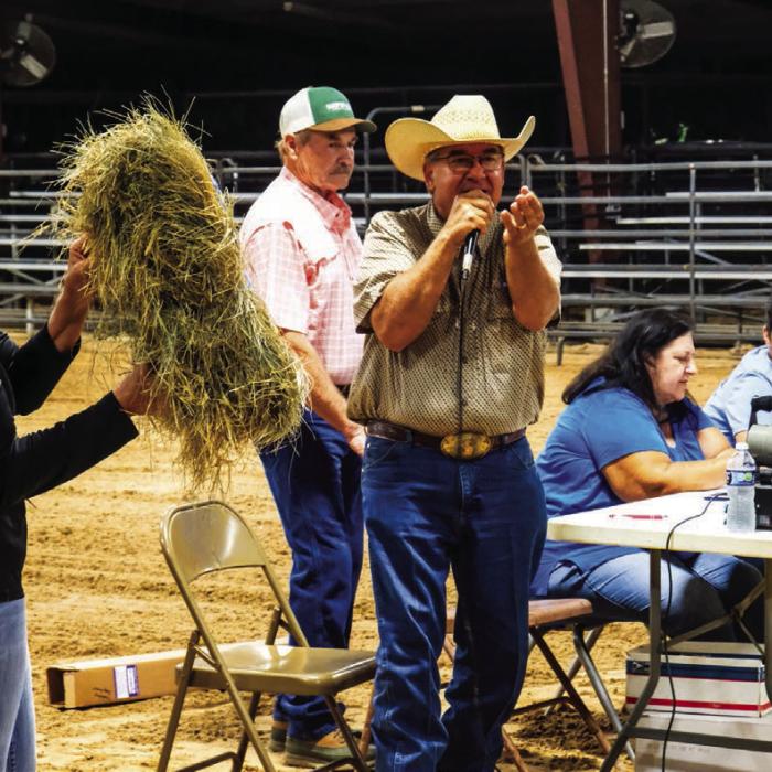 Joe Orsak served as the auctioneer for the Fayette County Fair Hay Show. Photos by Andy Behlen