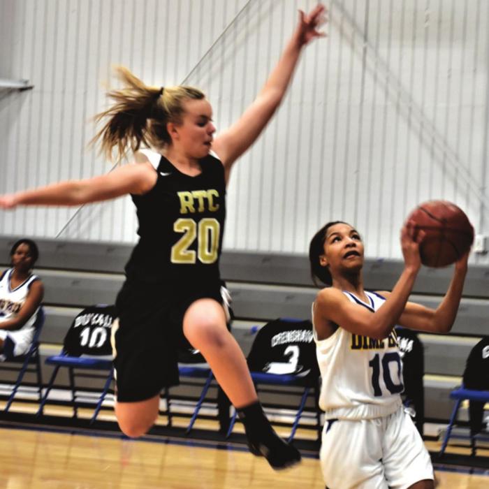 Round Top-Carmine’s Kim Rohde leaps to try to block this shot by a Dime Box player in Tuesday’s game. Photo by Paul Kipp