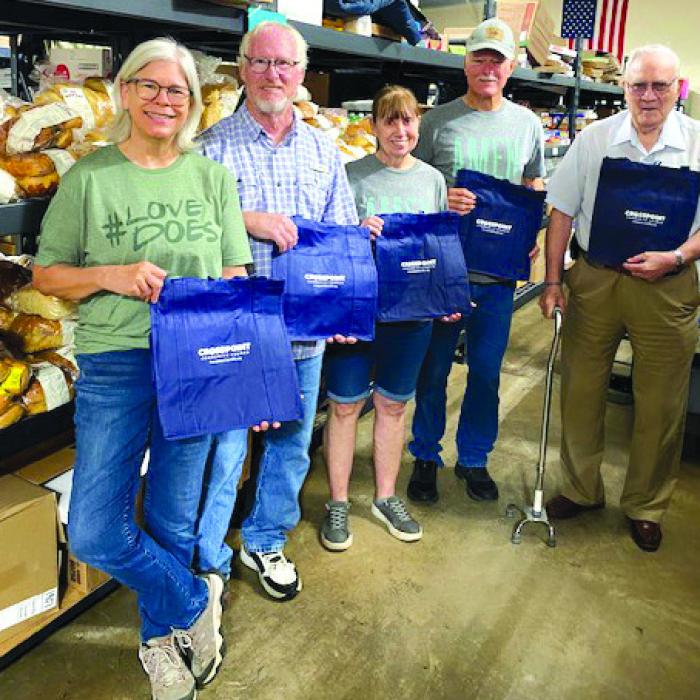 Crosspoint Community Church in La Grange donated 300 reusable bags to the AMEN Food Pantry. Pictured from left are Carol Caddell, Richard Lewis, Marlene Bolton, Roy Bolton, and Jim Smith.