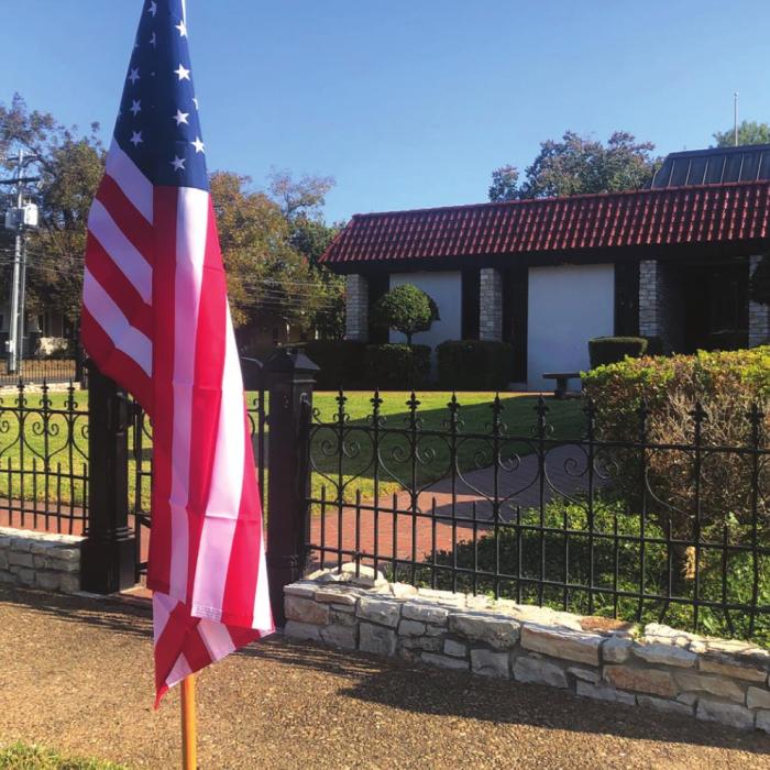 KJT Insurance offices place six flags in honor of Veterans Day supporting the La Grange Noon Lions Club subscription flag program.
