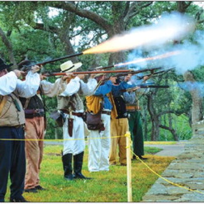 Reenactors fire a volley of rounds at the Monument Hill Remembrance Ceremony on Saturday. Photos by Andy Behlen