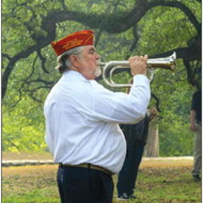 Bobby Bedient of the Colorado Valley Marine Corps League played taps at the conclusion of the ceremony.