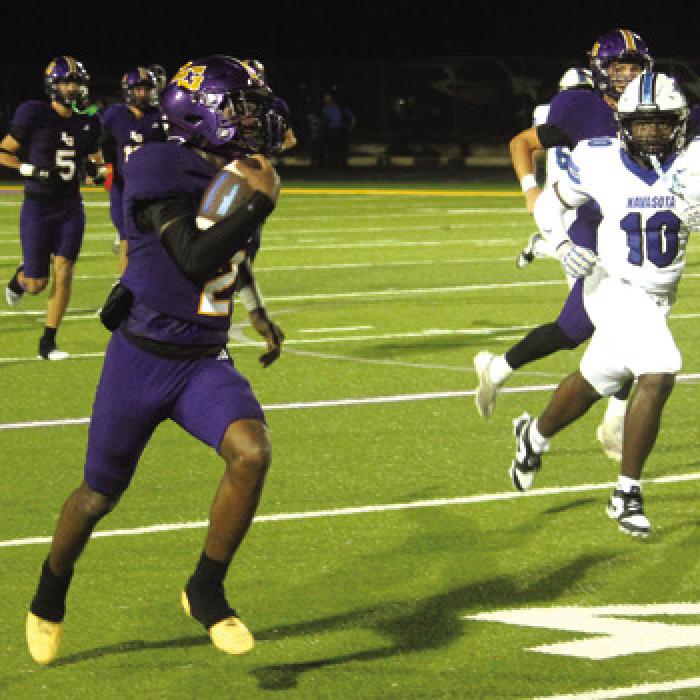 Howard Holmes finds some open space during a 50-yard punt return Friday. Photo by Jeff Wick