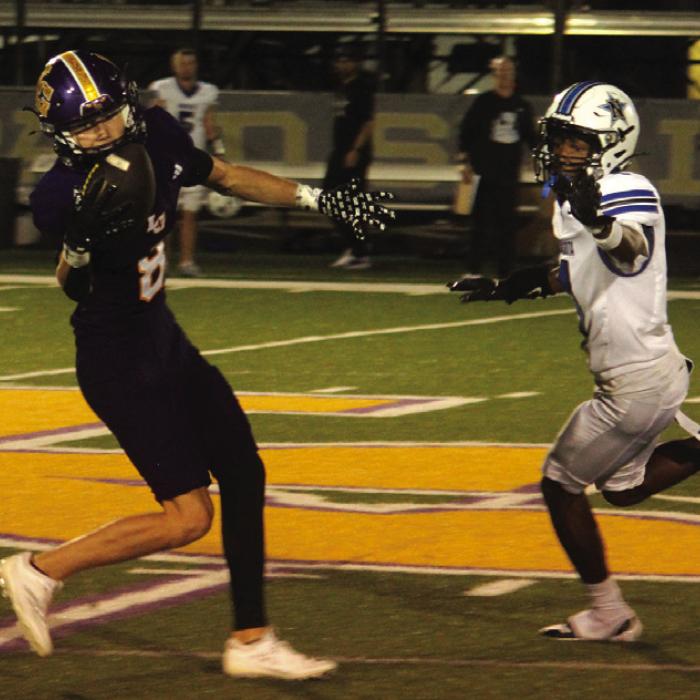 La Grange’s Klayton Michalka adjusts his route to make a remarkable one-handed catch as part of his 147 yards receiving in Friday’s game. Photo by Jeff Wick