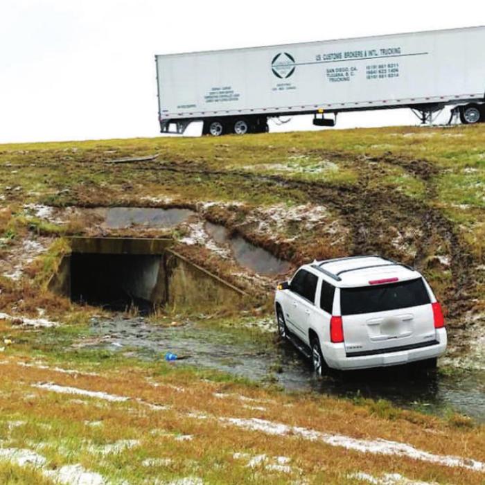 Below: Schulenburg Police assisted several motorists who slid off Interstate 10 Sunday in snowy and icy conditions, two of which are pictured above and below. There were no reported injuries. Photos by the Schulenburg Police Department