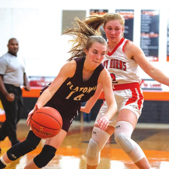Carly Bonds works around Schulenburg’s Erica Otto to get to the goal. Photo by Stephanie Steinhauser