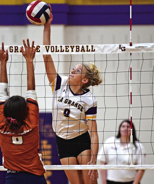La Grange freshman Carley Ulrich gets above the net in Friday’s victory. Photo by Stephanie Steinhauser