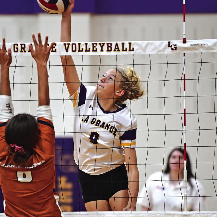 La Grange freshman Carley Ulrich gets above the net in Friday’s victory. Photo by Stephanie Steinhauser