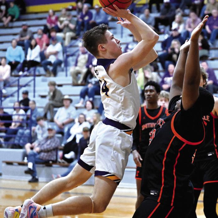 La Grange’s Clayton Knapik drives to the basket in Tuesday’s game against Smithville. Photo by Stephanie Steinhauser