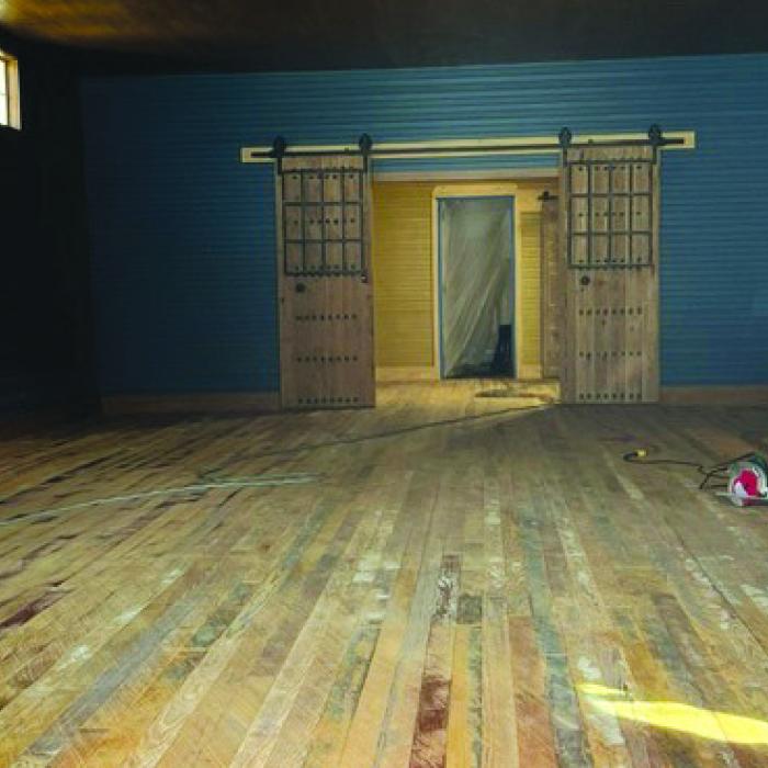 Floor restoration is underway at Hakan Rosengren’s building next to Huntington Bank.