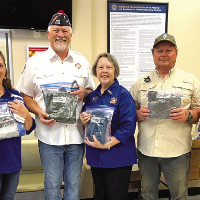 Donations through the Veterans Outreach Program sponsored by VFW Auxiliary No. 5254 La Grange were made to the Veterans Clinic in La Grange by (far left) Richard and Becky Leer in memory of Veterans John Leer and Lawrince Heinrich. Helping them present the donations were third from left, Commander Richard Gray and President Marilyn Kothmann, VFW Post and Auxiliary No. 5254 of La Grange, respectively; Roger Heinrich and Ninette Heinrich, children of Lawrince Heinrich; and Barbara Ryza, niece of John Leer.