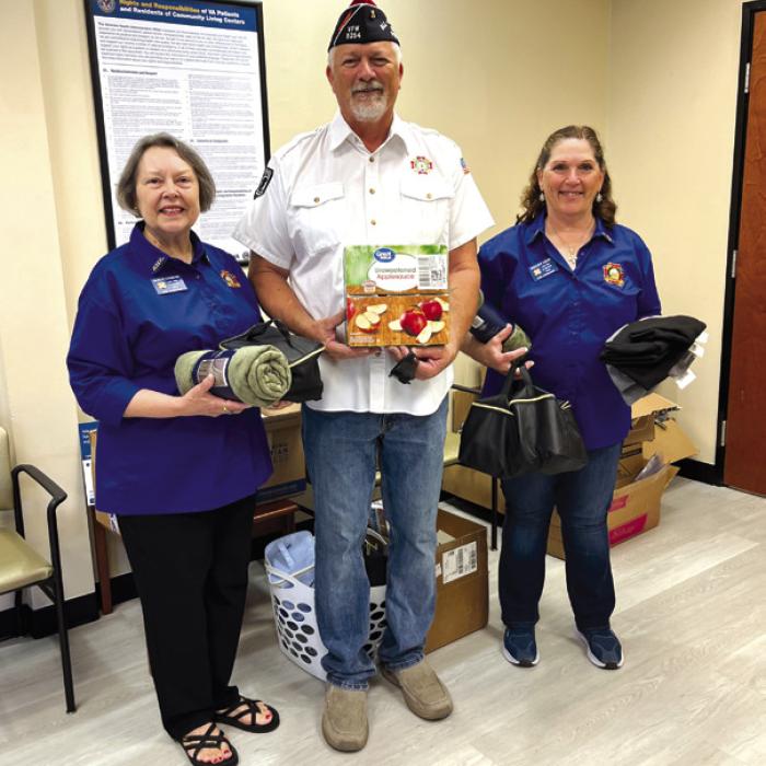 Presenting a donation to the Veterans Clinic in La Grange from the Veterans Outreach Program were VFW No. 5254 La Grange Auxiliary President Marilyn Kothmann and Post Commander Richard Gray, along with VFW Auxiliary No. 5254 La Grange Veterans Out-reach Program Chairman Becky Leer. The donation was made on behalf of Kathy Schenck in memory of her Father, Marine Lieutenant Paul Schenck and all Veterans.