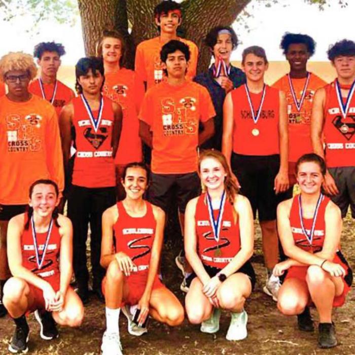 The Schulenburg cross country teams pose with their medals after Monday’s district meet in Shiner. Photo by Dave Oldham