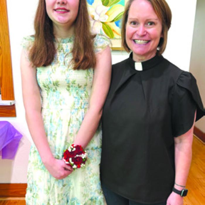 Miranda Gross was confi rmed at St. Paul Lutheran Church in Fayetteville. She is pictured here with Pastor Jen Kindsvatter.