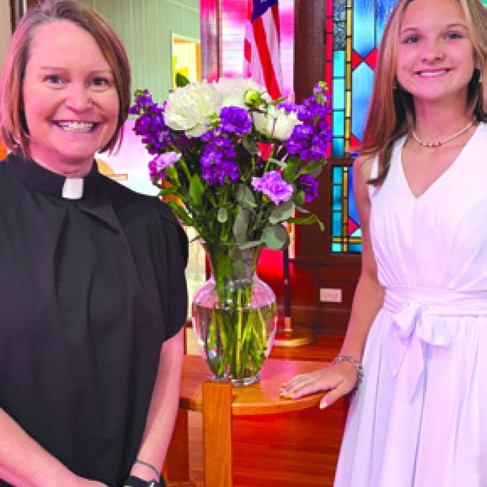 Brylee Brugger was confi rmed at St. John Lutheran Church in Ellinger. She is pictured here with Pastor Jen Kindsvatter.