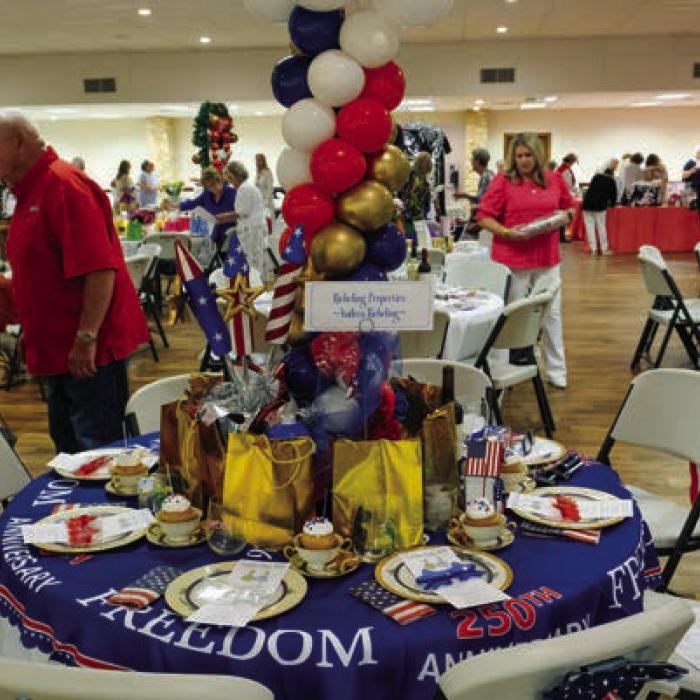 This table celebrating the United States’ 250th Anniversary was sponsored by Andrea Riebeling and Riebeling Properties.