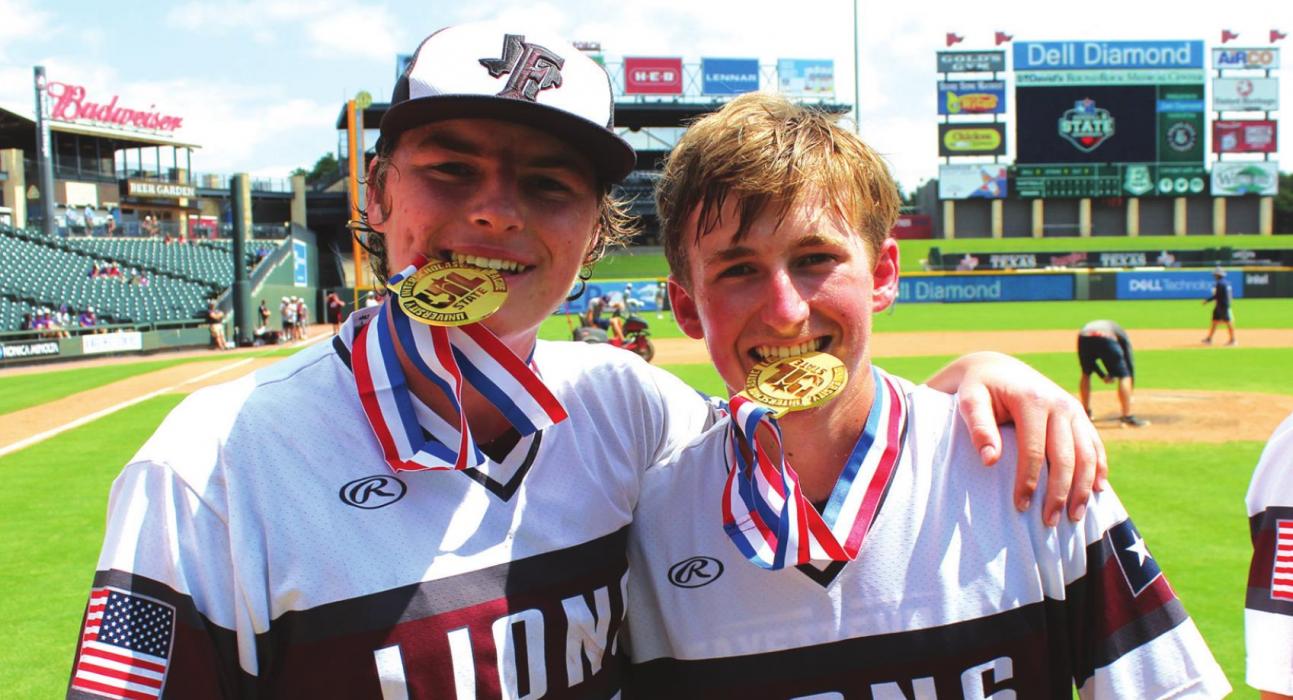 Parker Vitek, left, and Logan Fritsch, right, savor their state championship medals.