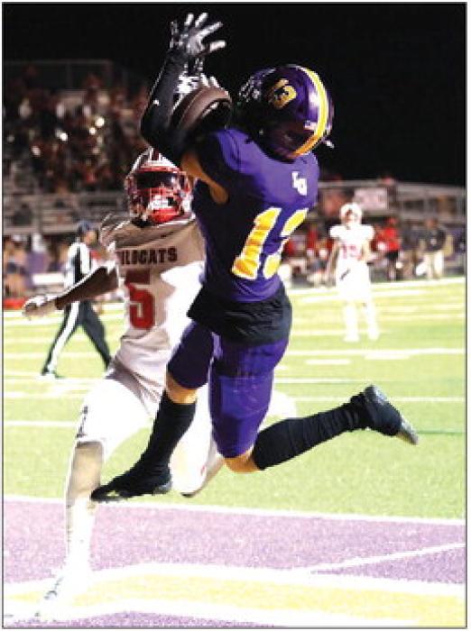 La Grange’s Julian Sherman makes this leaping catch in the endzone Friday for a touchdown. He had two touchdown catches and 104 yards receiving Friday. Photo by Katy Michalke