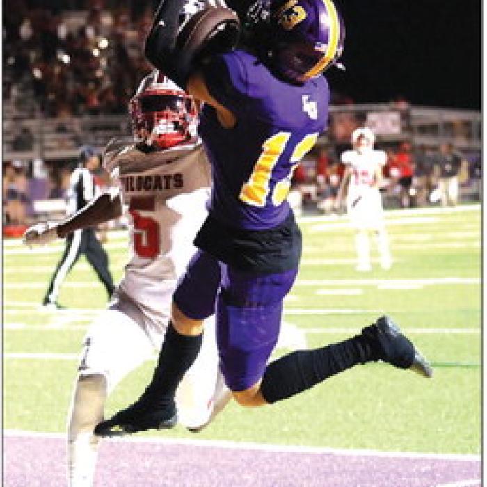 La Grange’s Julian Sherman makes this leaping catch in the endzone Friday for a touchdown. He had two touchdown catches and 104 yards receiving Friday. Photo by Katy Michalke
