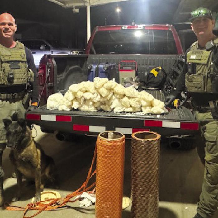 Sgt. Randy Thumann, K9 Kolt, and Investigator David Smith.