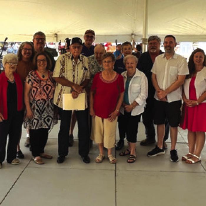 Representatives from the Austin Aquafest Organization, which ran from 1962 to 1998 made a $25,000 donation to the Czech Center from funds the group still had.