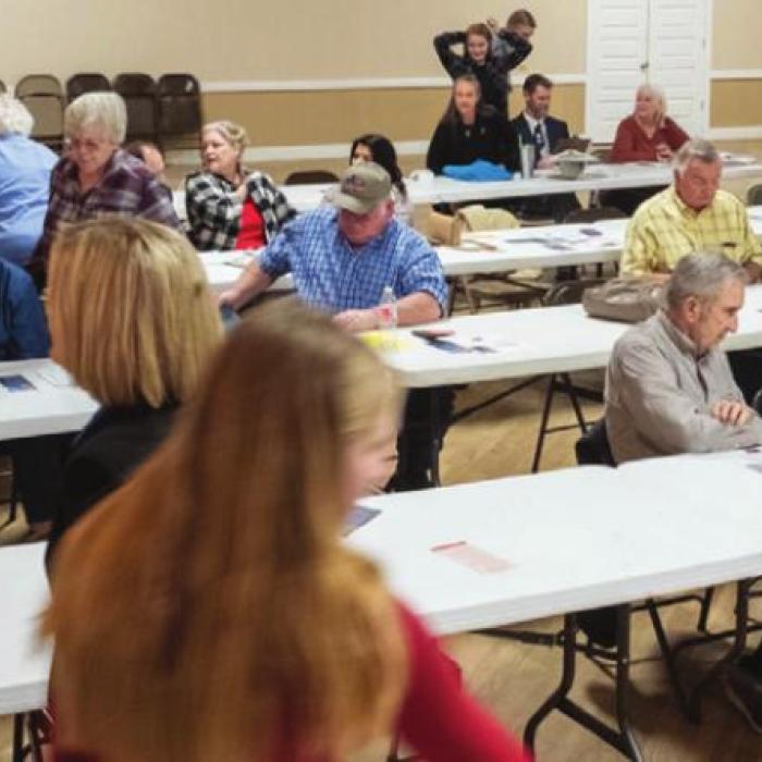 Folks begin to gather Saturday before Ellinger’s forum. Photo by Andy Behlen