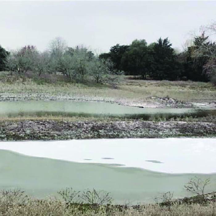 Debbie Kelly sent us this photo of a pond in Muldoon with ice covering about half of it.