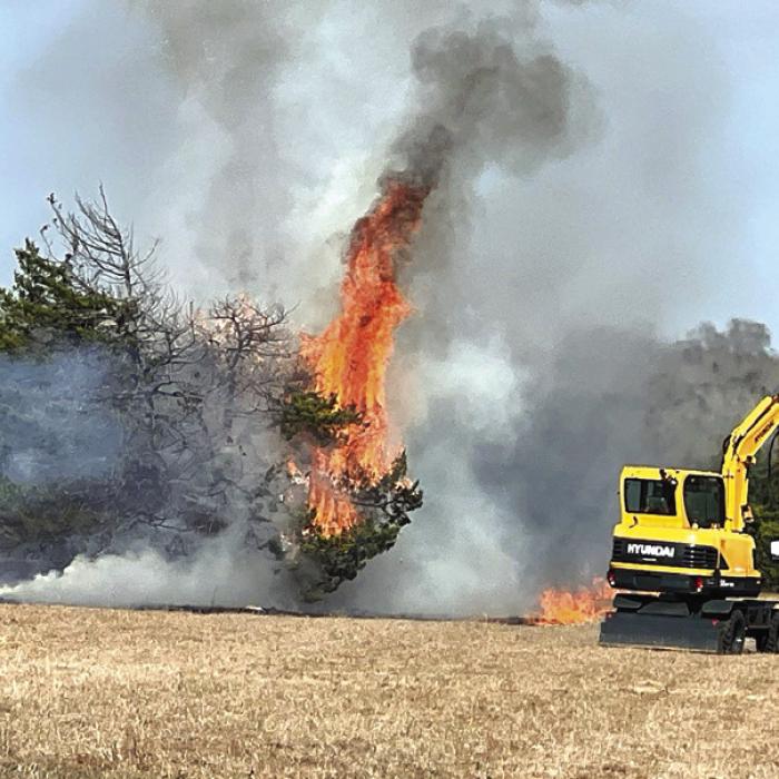 Firefighters and landowners spent about two hours battling Friday’s fire. Photo courtesy of Craig Moreau