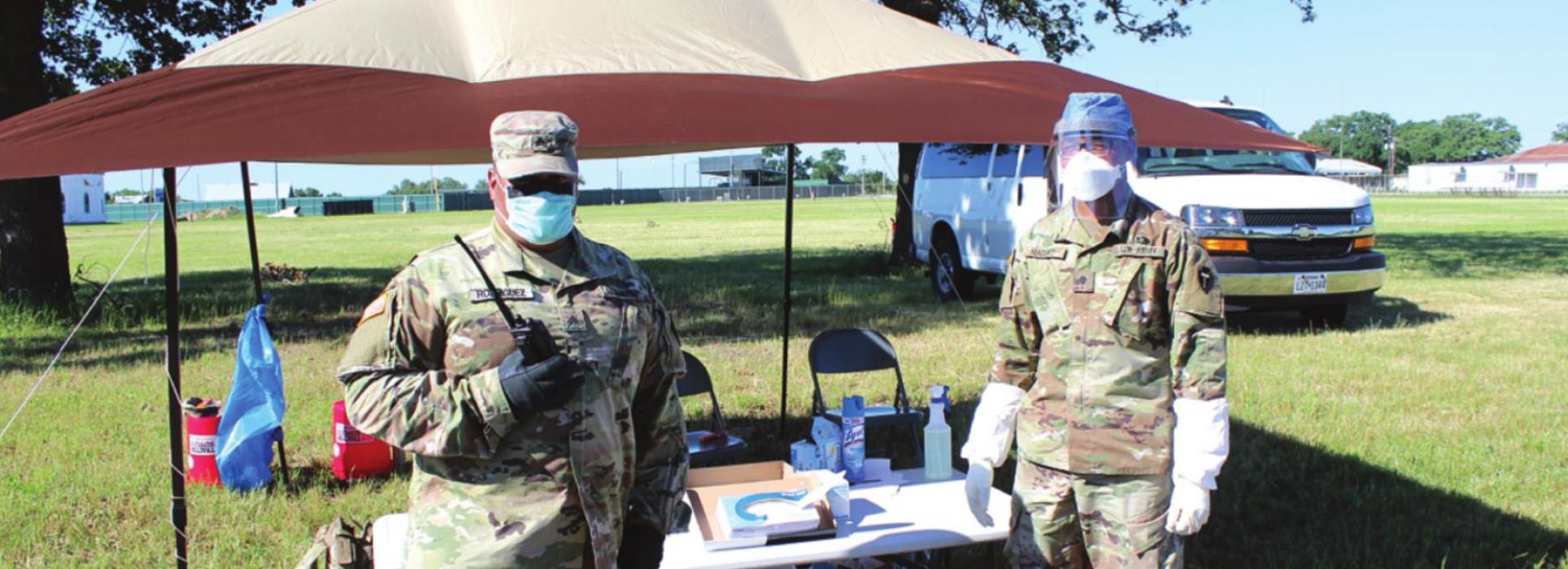 Two members of the National Guard were stationed near the entry to the fairgrounds to assist attendees at Friday’s testing event. Photos by Jeff Wick