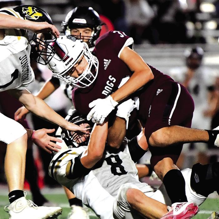 With 2:15 left on the clock in the 3rd quarter, Caysen Perez takes the handoff from quarterback Fidel Venegas and runs to pick up a first down for The Flatonia Bulldogs in Thursday night’s bi-district playoff game in San Antonio. Photo by Stephanie Steinhauser