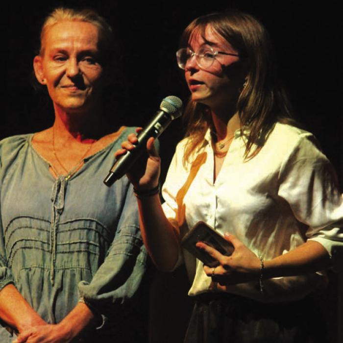 Student director Riley Lowe, right, speaks to the crowd before Friday’s performance, along with adult coordinator Melissa Weltner, left. Photos by Jeff Wick