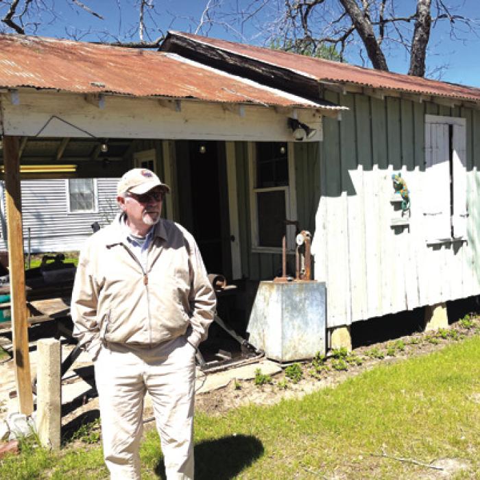 Pancho Howze stands outside the old Goebel Store in the far northwest corner of Fayette County.