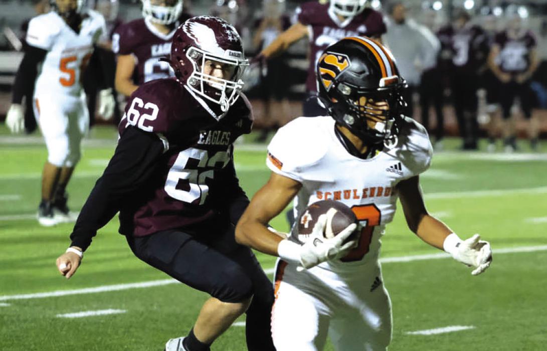 Schulenburg receiver Byron Johnson evades Johnson City defenders on his way to the endzone. Photos by Andy Behlen