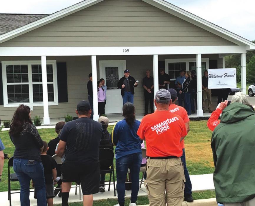 The dedication of the 20th and final home built by Samaritan’s Purse at Hope Hill at 109 Joy St. The Samaritan’s Purse builders are moving to Lake Charles, Louisiana soon to join the rebuild efforts there. Photo courtesy of Frank Smith